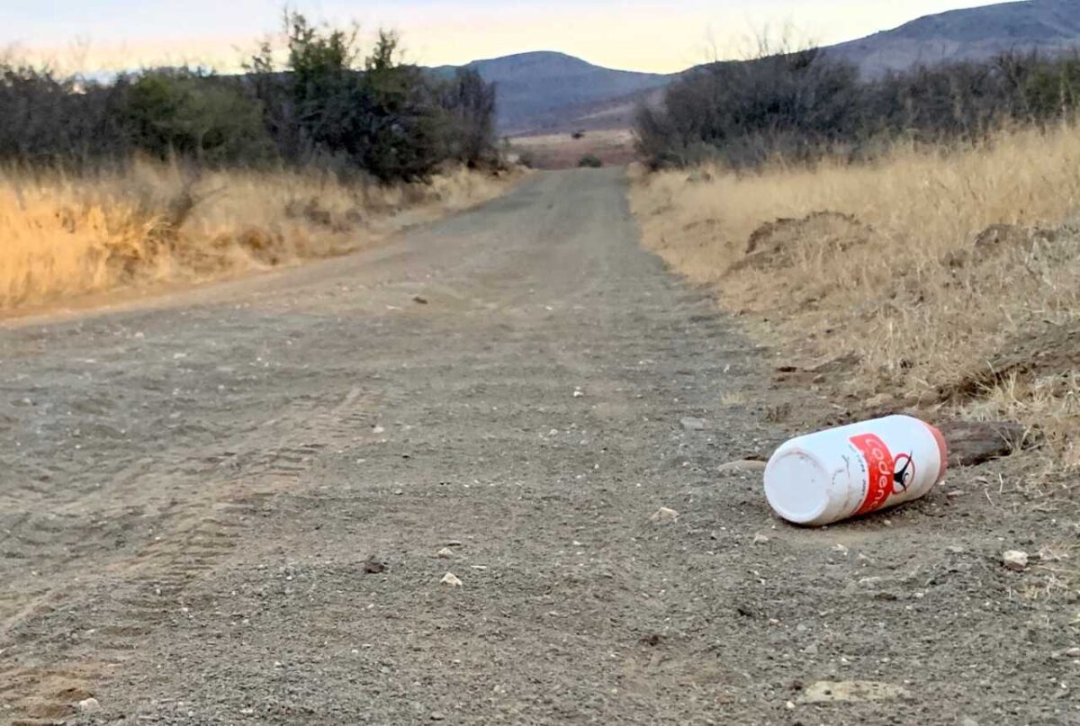 chasing-the-sun-gravel-bike-bike-market-1280x861 water bottle on a gravel road